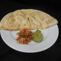 Chicken Quesadilla · Chipotle ranch drizzle, guacamole, and pico de gallo.