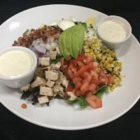 Cobb Salad · Bacon, chicken, egg, corn, tomato, avocado, red onion, blue cheese, and choice of dressing.