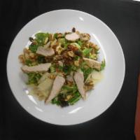 Shaved Brussels Sprouts Salad · Nueske bacon, arugula, toasted walnuts, shaved Parmesan, raisins, grilled chicken breast, an...