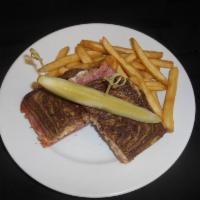 Classic Reuben Sandwich · Corned beef or turkey, sauerkraut, Swiss, 1000 Island, and marble rye.