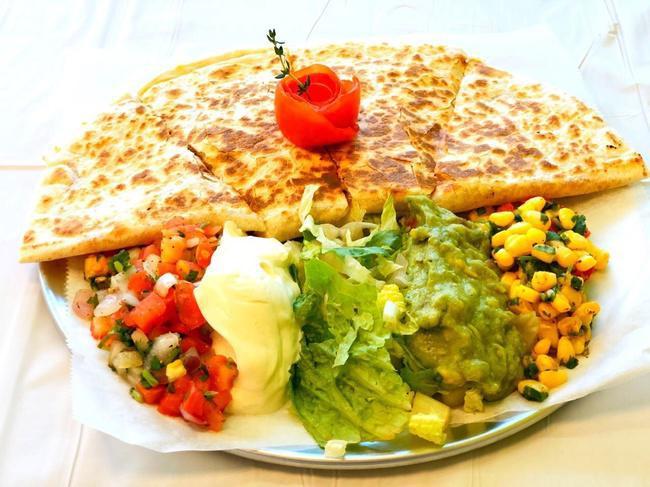 **BAJA QUESADILLA** · Grilled White or Wheat Flour Tortilla with cheese and choice of Meat. Choice of sides: lettuce, pico de gallo, corn salsa, sour cream, guacamole.