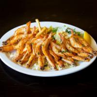 Grilled butterflied whole shrimp  · Served with choice of 2 sides.