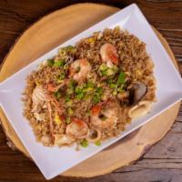 Chaufa De Mariscos · A Chinese-Peruvian seafood fried rice fusion. Accompanied with mussles, shrimps, calamari, a...