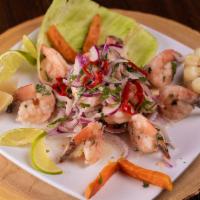 Ceviche De Camaron · Fresh shrimps marinated in lime juice; infused with red onions. Accompanied with inca corn, ...