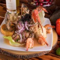 Ceviche Mixto · Fresh sliced fish fillet, shrimps, calamari, mussel and crab marinated in lime juice and inf...