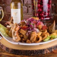 Jalea · Traditional Peruvian batter-coated calamari, mussels, fish chunks, shrimps and crab fried to...