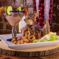 Classico  · A Traditional combination of fish ceviche and batter coated fried calamari, mussles, shrimps...