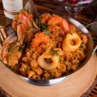 Arroz con Mariscos · Traditional Peruvian paella with aji amarillo seafood rice; accompanied with calamari, musse...