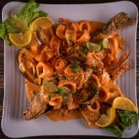 Pargo a Lo Macho (Red Snapper) · A whole red snapper with creamy calamari, mussels, shrimps and crab seafood sauce on top. Ac...