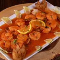Camarones Al Ajillo · Shrimp in garlic sauce with boiled potatoes and Served with white rice. 