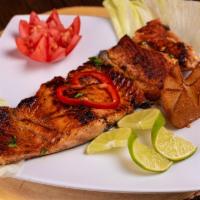 Salmon · Grilled seasoned salmon accompanied with your choice of two sides. 