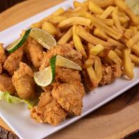 Chicharron De Pollo · Deep-fried chicken cuts with french fries.
