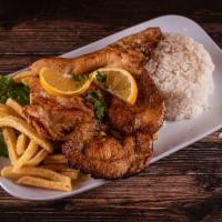 Pechuga La Plancha · Seasoned chicken breast fried on a skillet, accompanied with French fries, white rice, and t...