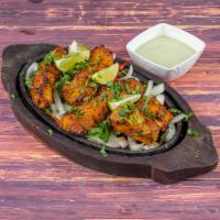 Chicken Tikka Specialty · Chicken chunks marinated with Indian spices and grilled in clay oven.