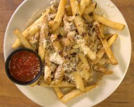 Garlic Parmesan Fries · Our skin on fries tossed with freshly roasted garlic and Parmesan cheese.