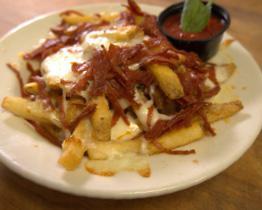 Pizza Fries · Skin on fries tossed with pepperoni pieces and served with a side of our homemade marinara.