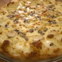 Chicken Alfredo Pizza · Alfredo sauce, mozzarella cheese, grilled chicken and baby portabella mushrooms.