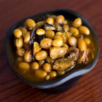 Wilbur Beans · Baked beans loaded with smoked pork, brisket, hot link sausage and jalapeño peppers.