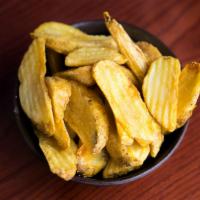 Famous Fries · Crispy-fried, thick-cut, skin-on Russet potato wedges.