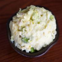 Potato Salad · Potatoes with red onion, celery, hard-cooked egg, mayonnaise and a hint of mustard.