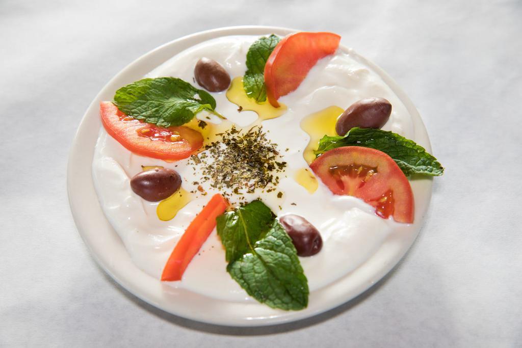 Labneh · Filtered yogurt spread served with olive oil, dry mint and black olives. 