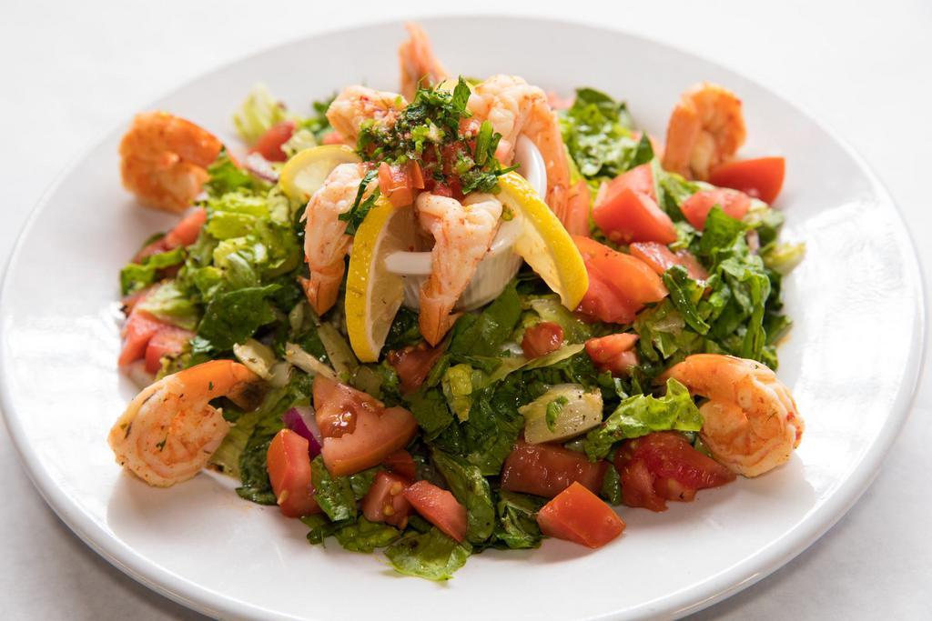 Nart's Shrimp Salad · Romaine lettuce, tomatoes and onions topped with succulent sauteed shrimp; tossed in our house dressing. 