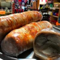 Arrollado Huaso Sandwich · Cold pork rolled and seasoned Chilean style.