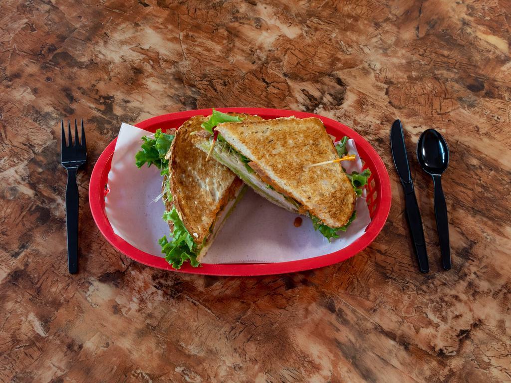 Santa Fe Club Sandwich Combo · Turkey, bacon, avocado, lettuce, tomato, sprouts and chipotle mayo served on toasted multi-grain. Includes side of potato salad, macaroni salad, coleslaw, pasta salad or chips and a 20 oz. drink.