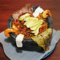 Molcajete · Served with beef, chicken, shrimp, chorizo, cheese and nopales.
