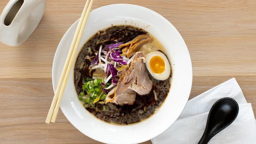 Ma Yu Paitan Ramen · Creamy broth ramen made from a mixture of chicken and pork with black garlic oil. topped with ajitama, umami egg, bean sprouts, red cabbage mix, and bamboo shoots. Choose between chicken or pork chashu.