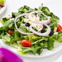 Greek Salad · Cucumbers, feta cheese, red onions, olives, and tomatoes over romaine lettuce