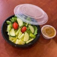 Green Salad · Side salad with romaine lettuce, cucumber, and tomatoes with balsamic vinaigrette dressing