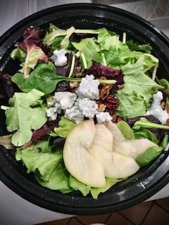 Harvest Salad · Mixed spring greens, apple slices, dried cranberries, blue cheese, and candied walnuts with balsamic vinaigrette dressing.