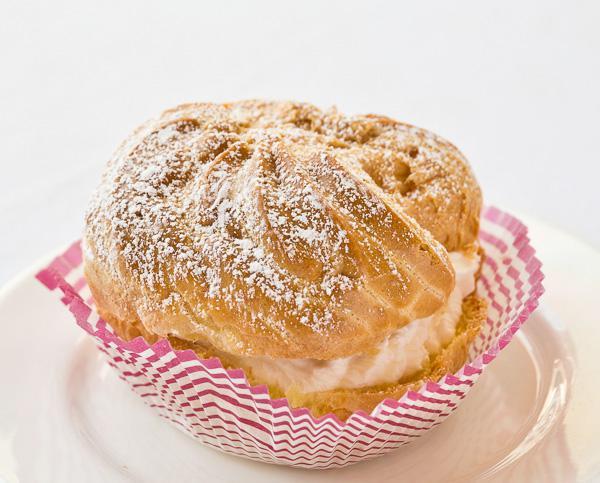 Cream Puff · Classic dessert filled with fresh whipped cream and dusted with powder sugar