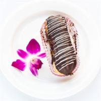 Eclair Pastry · Classic dessert filled with vanilla custard and topped with a layer of chocolate ganache