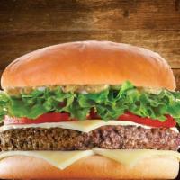 Beef Burger · 100% grass fed beef, lettuce, tomato, onion, pickles and our house made signature sauce.