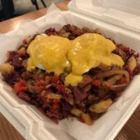 Corned Beef Hash · Onion, roasted red peppers, potatoes topped with poached eggs and Dijon hollandaise.