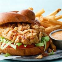 Forrest’s Crab Cake Sandwich  · Our Lump Crabmeat Cake with sliced Tomato and Lettuce on a Toasted Bun. Served with Remoulad...