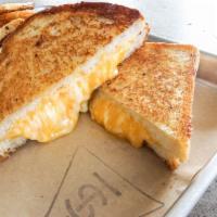 Grilled Cheese Sandwich · 4 complementary cheeses and sourdough. Vegetarian.