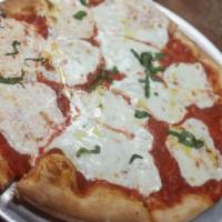 Margherita Pizza · Tomatoes, fresh mozzarella, basil, and extra virgin olive oil