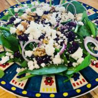 The Green Goat Salad · Fresh spinach, goat cheese, dried cranberries, walnuts and red onions.