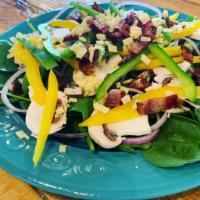 BCC Salad · Fresh spinach, raw bell pepper, red onions, raw mushrooms, bacon and shredded cheddar.