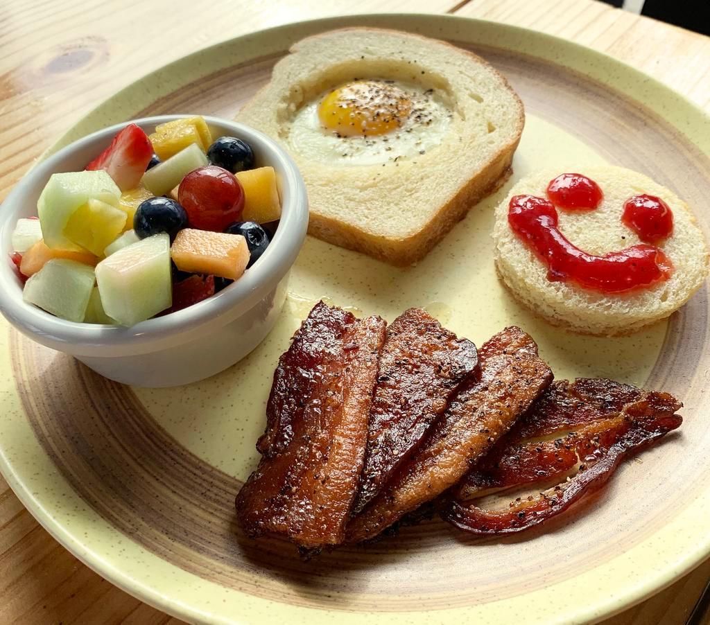 Willie Toast · Our house made bread with an egg nested in the center, with your choice of bacon or chicken sausage and a cup of fruit.