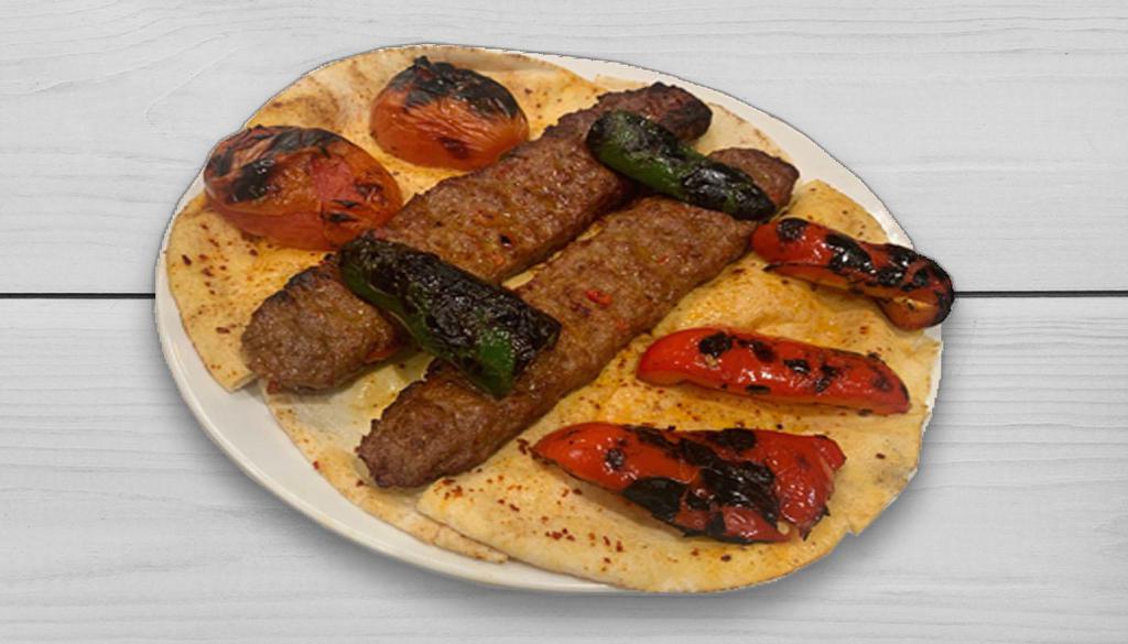 Adana Kabob ( Mild Spicy ) · Ground beef and ground lamb mixed with special spices and served two sides, 2 pita bread
