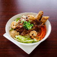 Grilled Pork, Shrimp and Cha Gio Vermicelli Bowl · Served with fresh lettuce, herbs, bean sprouts, cucumber, house special fish sauce, and topp...