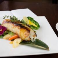 Miso Chilean Sea Bass · server with veg.chef special miso sauce .