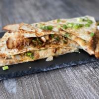 Pork Belly Quesadilla · Sliced pork belly with cheese, hoisin sauce, cilantro, scallions and onions.