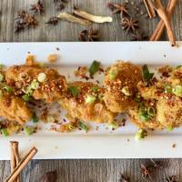 Salt and Pepper Chicken Wings · Lightly dusted wings, spice blend and sun-dried chili peppers.