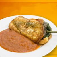 Chille Relleno Single · Stuffed green chile that has been breaded, fried, and topped with sauce