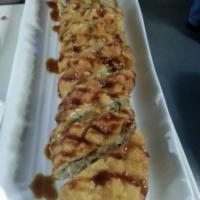 Vikki's Roll · In shrimp tempura, salmon, cream cheese, avo, imt crab. Out: whole roll deep fried, eel sauce.